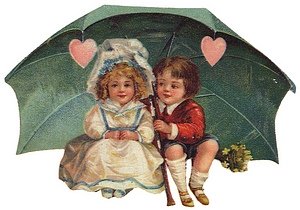 Boy and girl under Valentine umbrella with hearts.