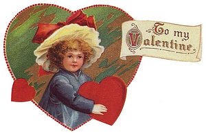 Girl holding heart that says "To my Valentine."